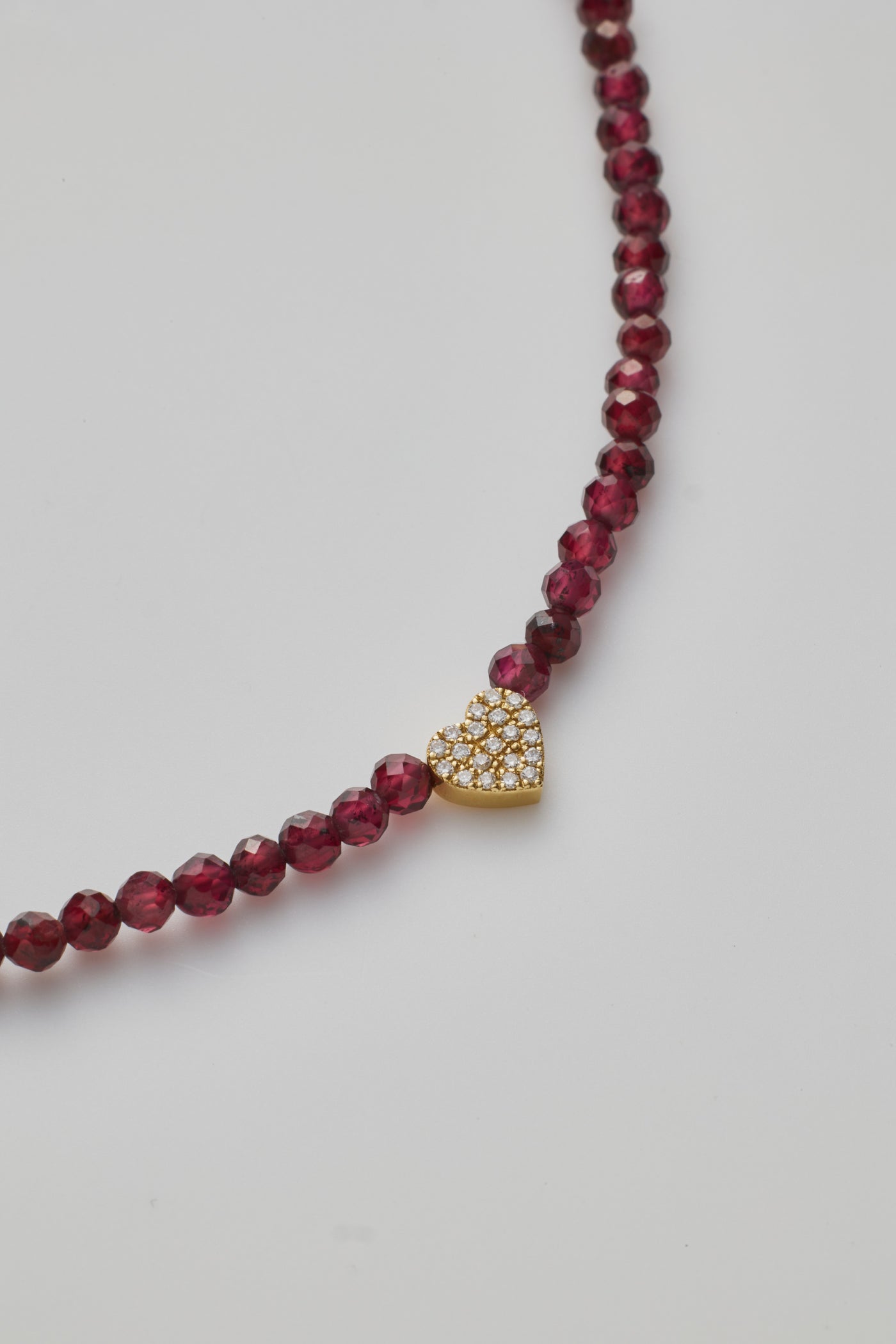 Small red garnet beads with gold heart bracelet 