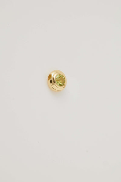 Side view image of the August Birthstone Charm featuring a vibrant peridot gemstone in a sleek setting, radiating a bright green hue. A symbol of joy and growth, perfect for celebrating August birthdays."