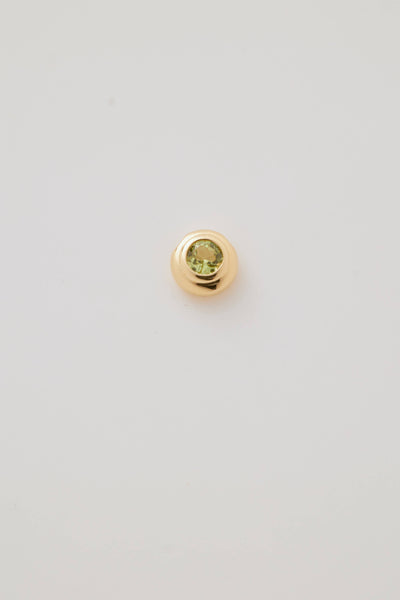 Close-up image of the August Birthstone Charm featuring a vibrant peridot gemstone in a sleek setting, radiating a bright green hue. A symbol of joy and growth, perfect for celebrating August birthdays.