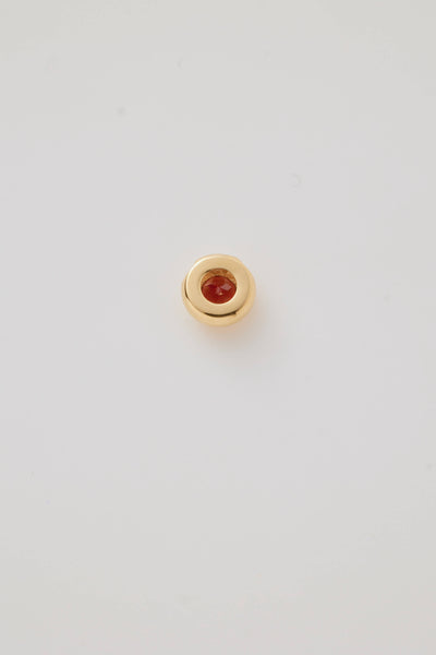 Reverse side view shows a January Birthstone Charm featuring a rich red garnet gemstone in a polished gold setting. 