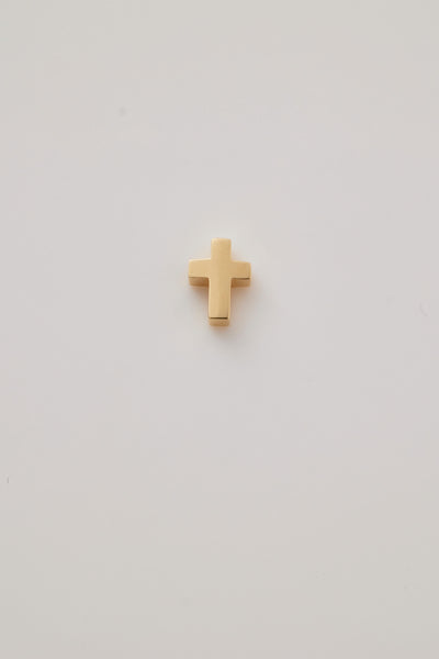 A gold three-dimensional Christian cross charm in yellow gold. Charm has a centre hole for threading a chain. 