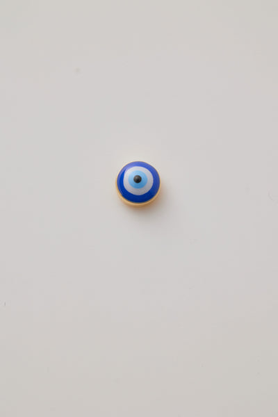 Front view of a gold and enamel Turkish eye charm featuring a vibrant blue and white design. Symbolic, striking, and perfect for any chain.