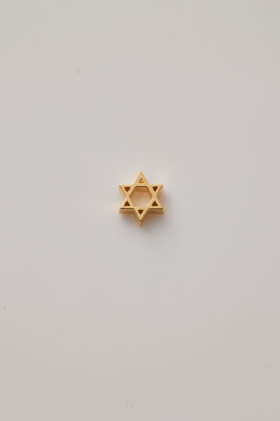 A beautifully crafted Star of David charm made from polished 18-karat gold with a sleek finish. The charm features two interlocking triangles creating the iconic six-pointed star, symbolizing unity and heritage. 