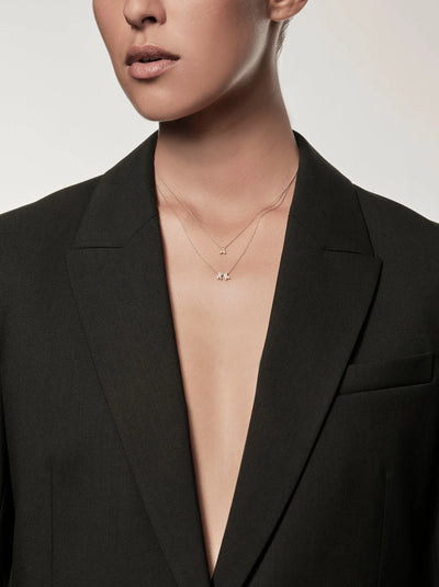 The "Letter A Necklace in 18k Gold" features a delicate pendant shaped like the letter "A," crafted from solid 18k gold. The necklace boasts a thin, lightweight chain with an openable connector clasp, ensuring ease of wear. Centered elegantly on the chain, the pendant adds a subtle touch of refinement. The plain white background accentuates the simplicity and elegance of this exquisite piece.