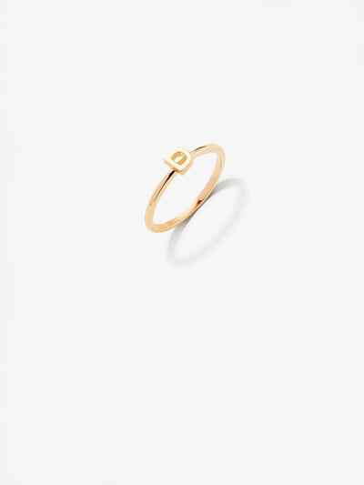 The Letter D Ring in 18k gold featuring a minimalist design with a simple rectangular accent on a plain white background.