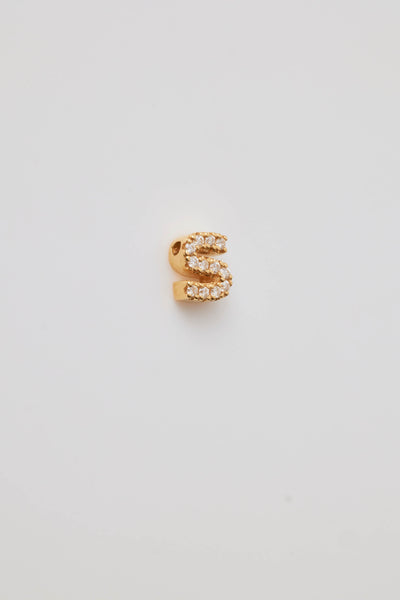 Small solid gold three-dimensional letter 'S' charm with pavé set diamonds, designed to thread onto a necklace chain.