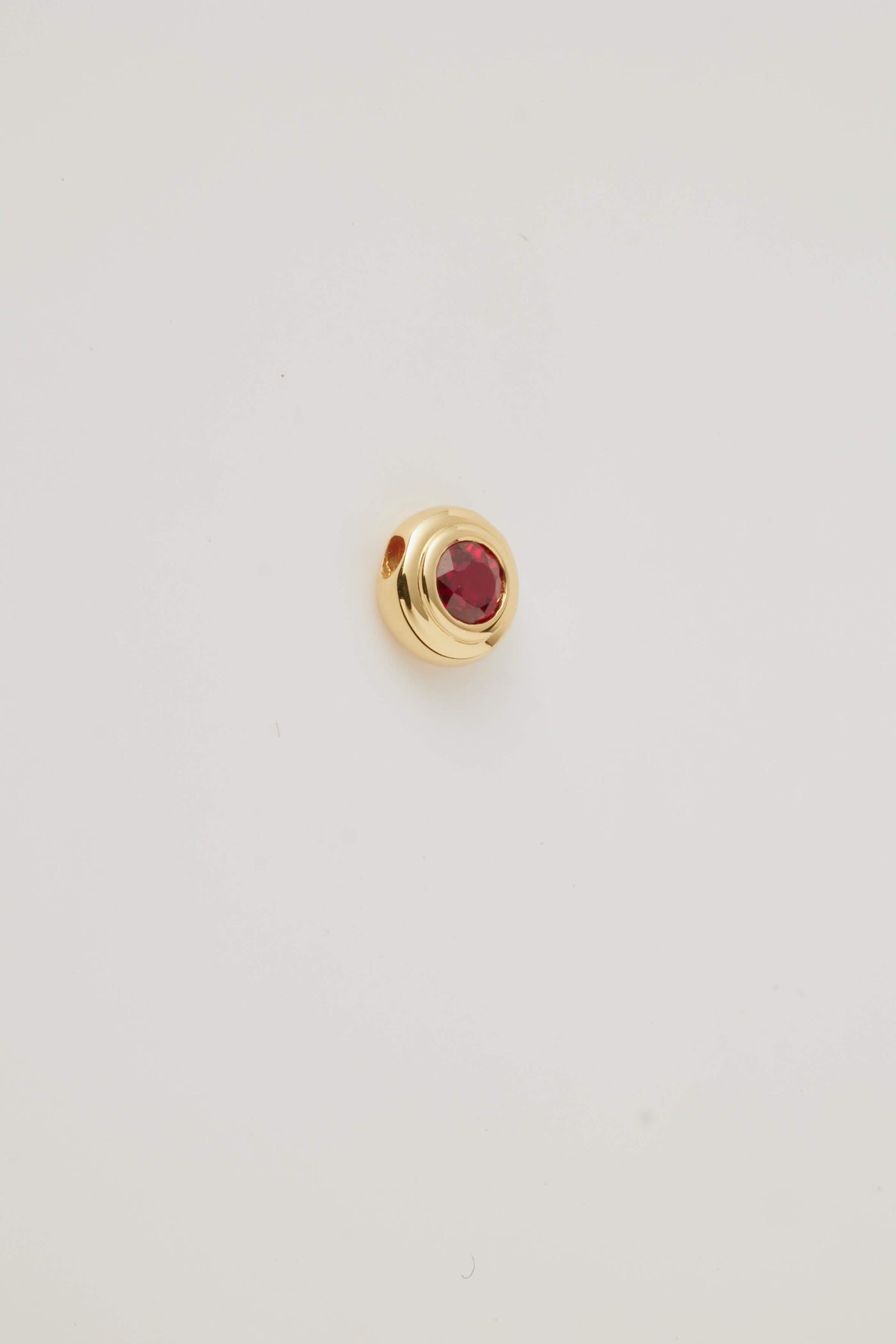 Solid gold birthstone charm ruby featuring genuine gemstones for each month, designed to slide onto a necklace chain for a personalised and meaningful jewellery piece.