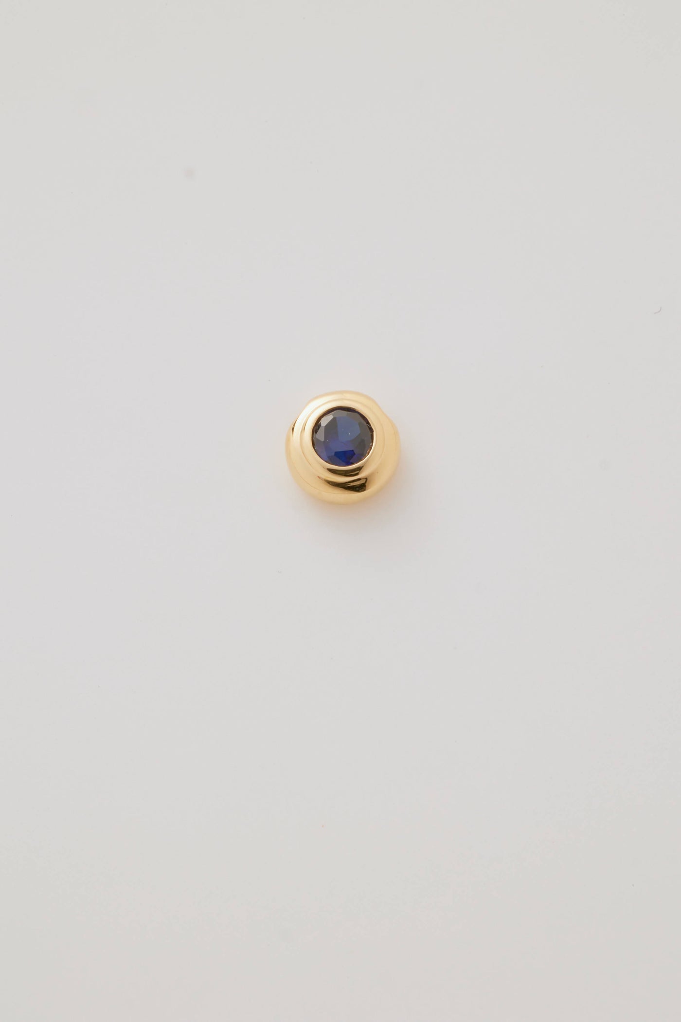 Solid gold birthstone charm sapphire for September featuring genuine gemstones for each month, designed to slide onto a necklace chain for a personalised and meaningful jewellery piece.
