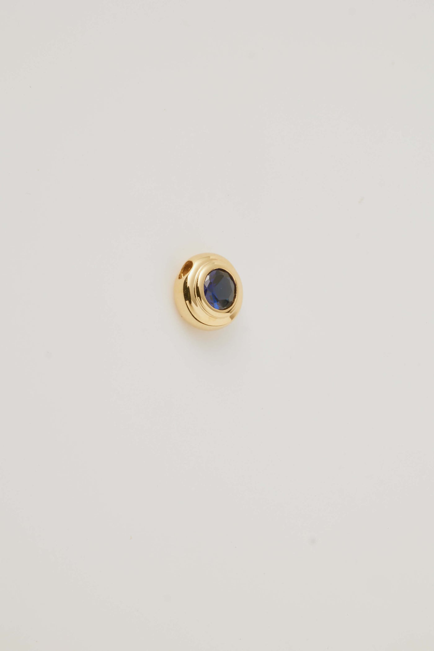 Solid gold birthstone charm sapphire for September featuring genuine gemstones for each month, designed to slide onto a necklace chain for a personalised and meaningful jewellery piece.
