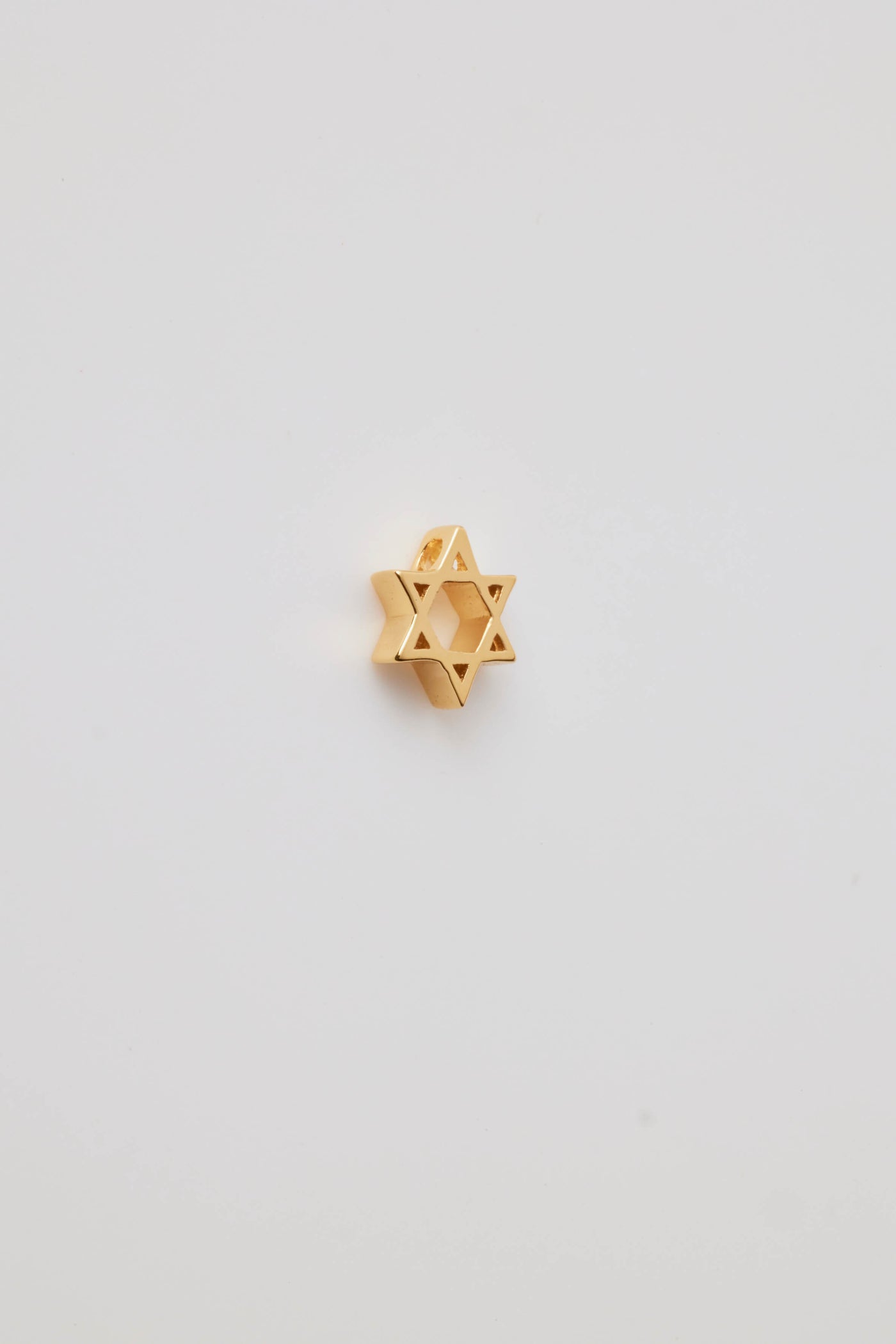 Small solid gold Star of David charm, designed to slide onto a necklace chain for a personalised jewellery piece.