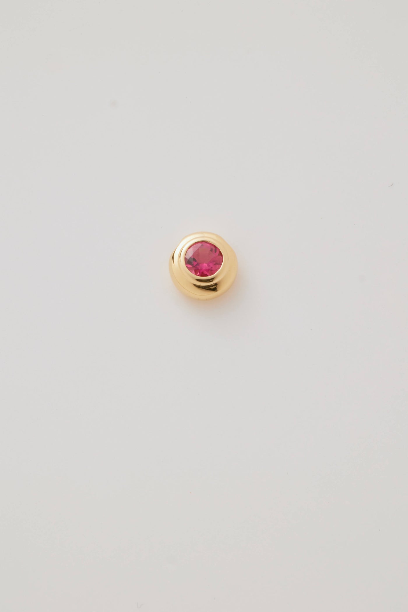 Solid gold birthstone charms featuring genuine gemstones for each month, designed to slide onto a necklace chain for a personalised and meaningful jewellery piece.