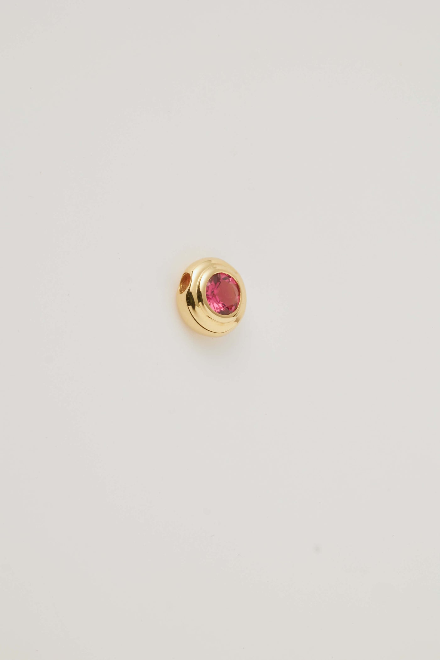 Solid gold birthstone charms featuring genuine gemstones for each month, designed to slide onto a necklace chain for a personalised and meaningful jewellery piece.