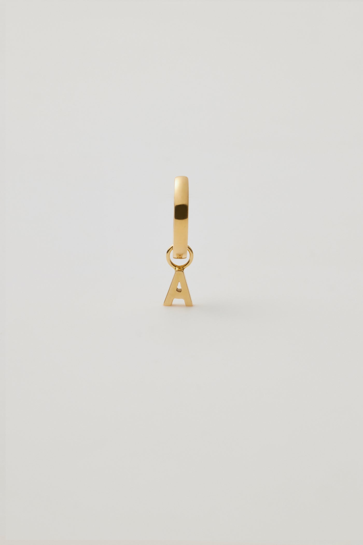 One Huggie & Gold Letter Charm