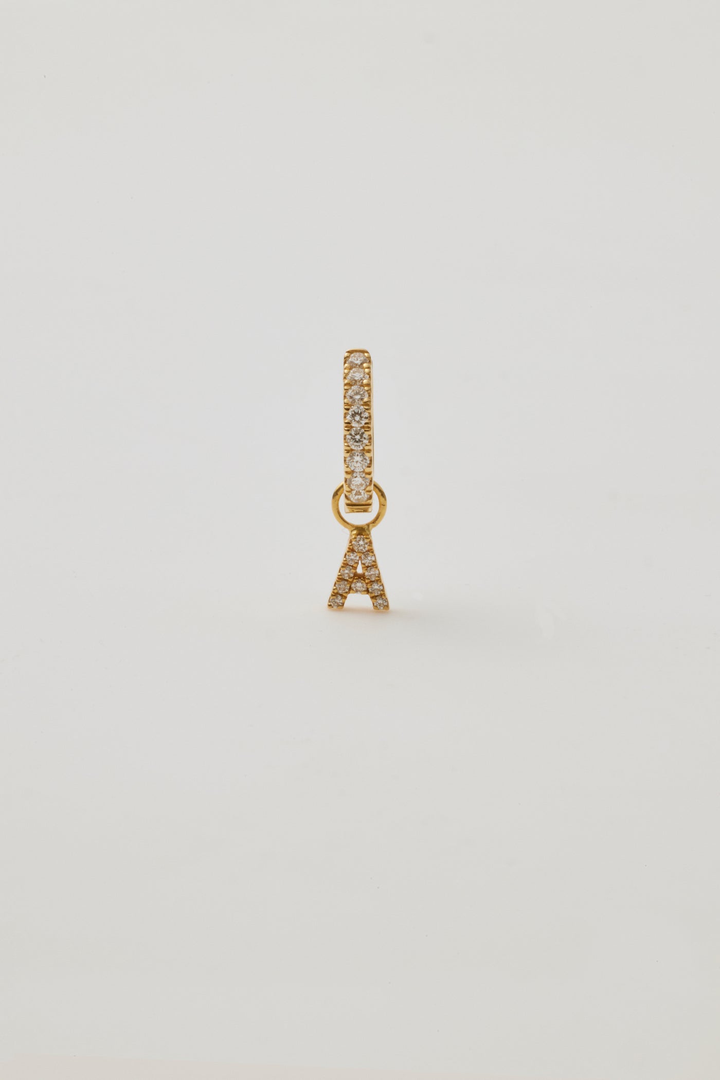 One White Sapphire Huggie & White Sapphire Letter Charm